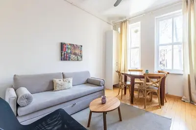 a living room with a couch and a table at Warm Cozy Charming 2BD2Bath GalataTower Gem! #256 in Istanbul