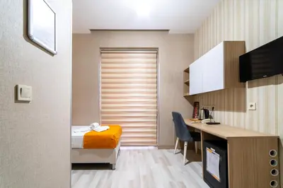 a room with a bed and a desk in a room at Mardy Hotel Ataturk Airport in Istanbul