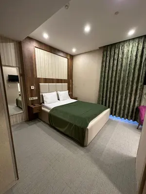 a bedroom with a large bed and a large window at Mardy Hotel Ataturk Airport in Istanbul