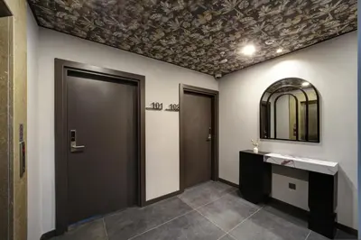 a bathroom with a door and a mirror on the wall at Second Suit Hotel in Istanbul