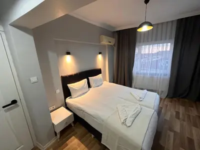 a bedroom with a large bed and a window at Asparagus HOTEL & SUITES OLD CITY in Istanbul