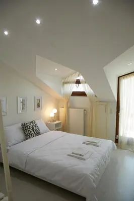 a large white bed in a room with a window at Kaplan Luxury Family Flat - 3 Bedrooms with air conditioning & heating in the City in Istanbul