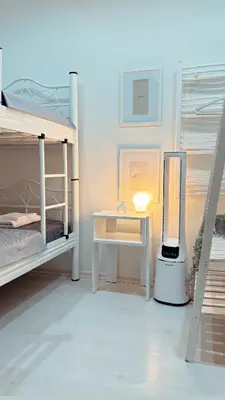 a room with two bunk beds and a desk with a mirror at Kaplan Luxury Family Flat - 3 Bedrooms with air conditioning & heating in the City in Istanbul