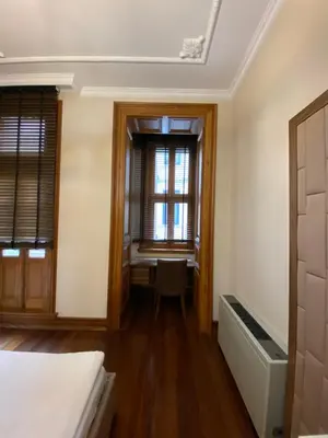 an empty room with a desk and a window at Aslan Residence in Istanbul