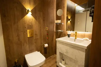 a bathroom with a white toilet and a sink at Kate Hotel Special Class & SPA in Istanbul