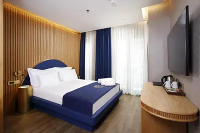 a hotel room with a bed and a table at Kate Hotel Special Class & SPA in Istanbul