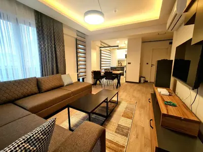 a living room with a couch and a table at Halij suite in Istanbul