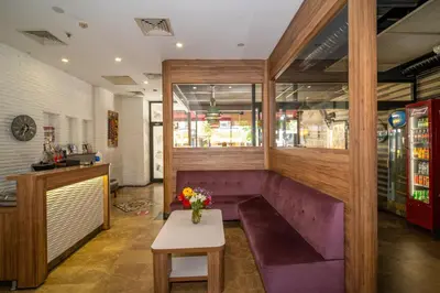 a purple bench in a restaurant with a table at Hotel Blisstanbul in Istanbul