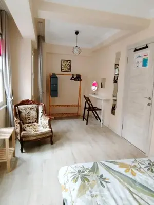 a room with a bed and a chair and a desk at İstanbulda merkezi pitoresk konum müstakil yeni ev in Istanbul