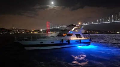a boat in the water in front of a bridge at PRUVA YACHT in Istanbul