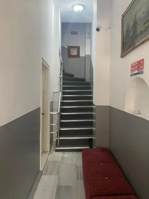 a stairway with a red bed in a hallway at Mara Suite Taxim in Istanbul