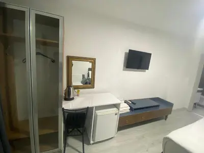 a bathroom with a sink and a mirror at Mara Suite Taxim in Istanbul