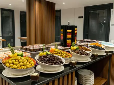 a buffet with bowls of fruit on a table at THE BOSFOR HOTEL in Istanbul