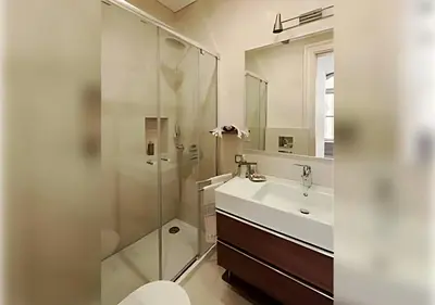 a bathroom with a sink and a glass shower at Baylo Suites in Istanbul