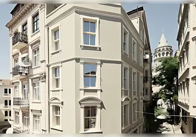 a white building with a clock tower in the background at Baylo Suites in Istanbul
