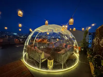 a iguana house on a rooftop at night at Waterfront Apartment by the Tram- Terrace with Dome & Golden Horn View in Fatih in Istanbul