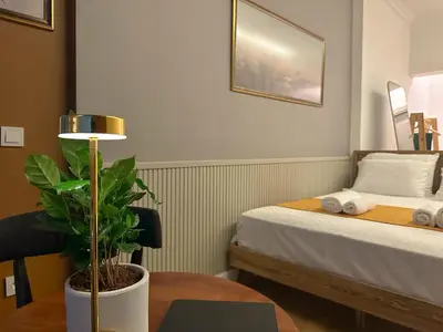 a hotel room with a bed and a table with a plant at The Haliç Bosphorus Hotel in Istanbul