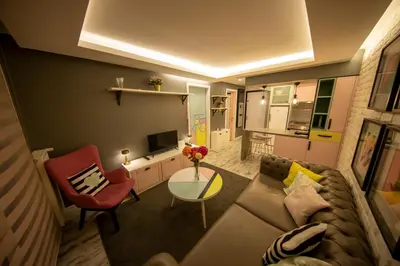 a living room with a couch and a table at Ava Istanbul City Center Hotel in Istanbul