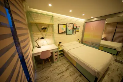 a small bedroom with a bed and a desk at Ava Istanbul City Center Hotel in Istanbul