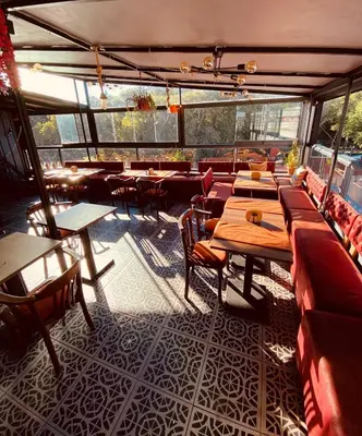 a restaurant with tables and chairs in a room at Ottoman Luxury Hotel in Istanbul
