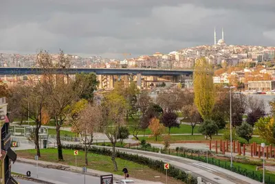 a view of a city with a bridge and buildings at Waterfront Apartment by the Tram - Terrace with Dome & Golden Horn View in Fatih in Istanbul