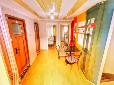 a dining room with a table and chairs at Taksim History Wooden Hostel in Istanbul