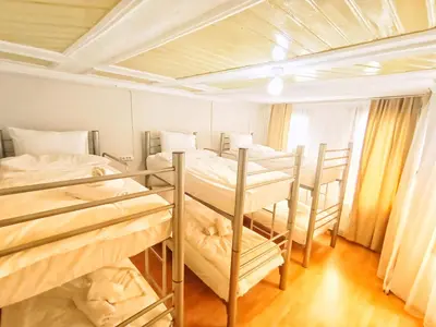 a group of bunk beds in a room at Taksim History Wooden Hostel in Istanbul