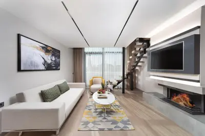 a living room with a couch and a fireplace at Nish Palace Beşiktaş in Istanbul