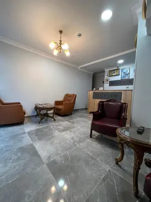 a waiting room with chairs and a table at MİRHAN HOTEL in Istanbul