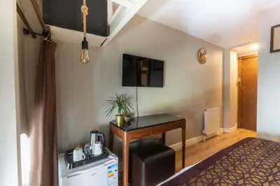 a hotel room with a desk and a bed at 6 Apartment Galata in Istanbul