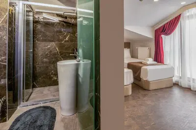 a bathroom with a shower and a tub in a room at Baymari Suites Design Florya in Istanbul