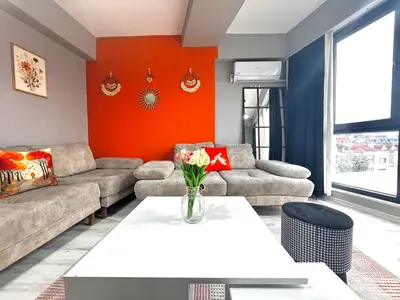 a living room with a couch and a table at Dilaver-Apart in Istanbul