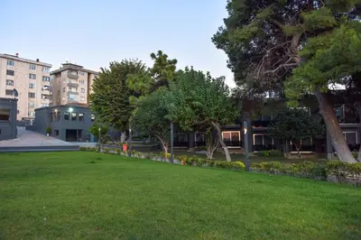 a park in front of a building at Denizatı Plus Hotel in Istanbul