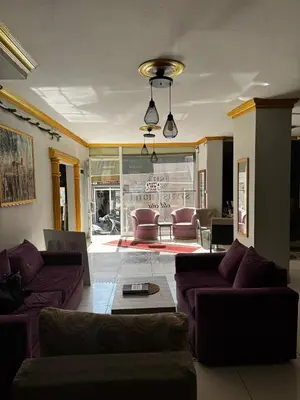 a living room with purple couches and a table at Stylish Hotel Old City in Istanbul
