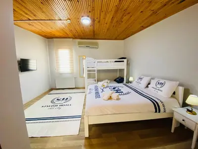 a bedroom with a bunk bed with a teddy bear on it at Stylish Hotel Old City in Istanbul