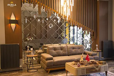 a living room with a couch and a table at Parla Suite Hotel in Esenyurt