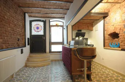a hallway with a desk and a door with a window at Casa 1899 in Istanbul