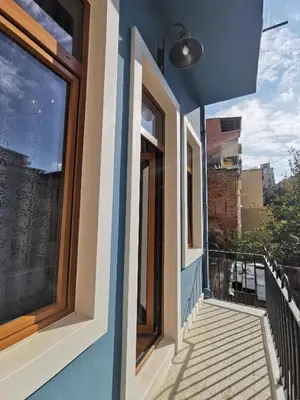 a house with a blue wall and windows at Casa 1899 in Istanbul