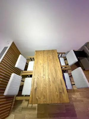 a wooden table and chairs in a room at Unique/Cosy flat near Taksim/Nişantaşı in Istanbul