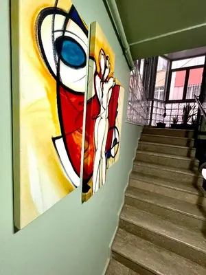 a painting of a woman on a wall next to stairs at Unique/Cosy flat near Taksim/Nişantaşı in Istanbul