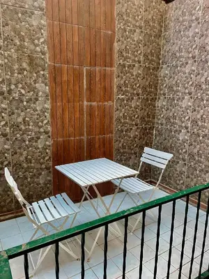 two chairs and a table on a balcony at Unique/Cosy flat near Taksim/Nişantaşı in Istanbul