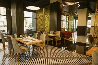 a restaurant with tables and chairs in a room at Aram Otel Business & Luxury in Istanbul