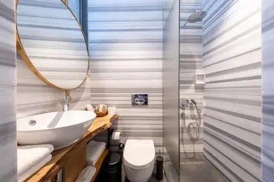 a bathroom with a sink and a toilet and a shower at Hotel Balo in Istanbul