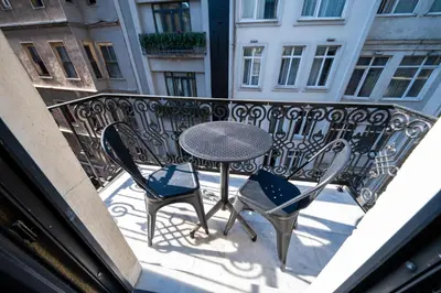 a table and chairs sitting on a balcony at Hotel Balo in Istanbul
