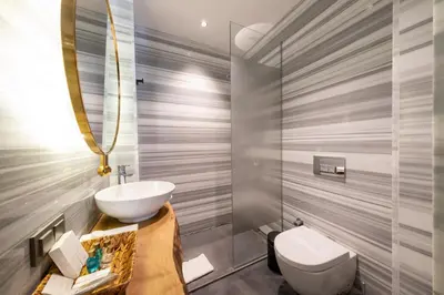 a bathroom with a sink and a toilet at Hotel Balo in Istanbul