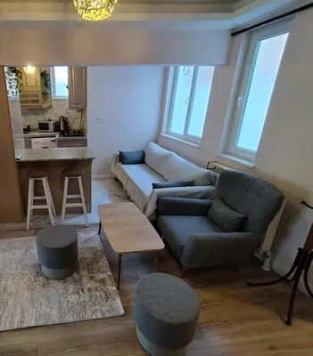 a living room with a couch and a table at Cozy Home Next to Green Mosque in Yıldırım