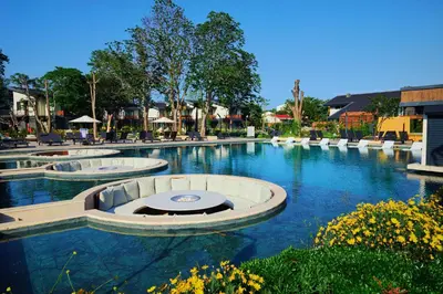 a swimming pool with blue water in a resort at Parmos Otel in Erdek