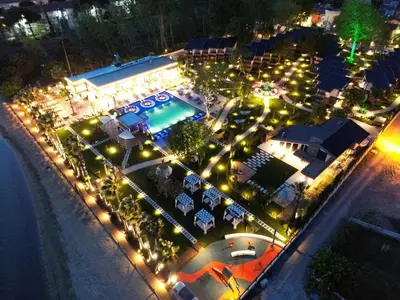 an overhead view of a pool at night with lights at Parmos Otel in Erdek
