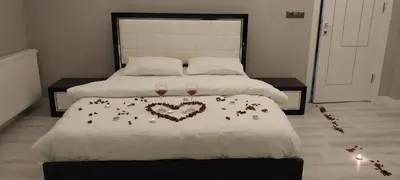 a bedroom with two beds with heart decorations on it at Begonvil Konaklama in Sapanca