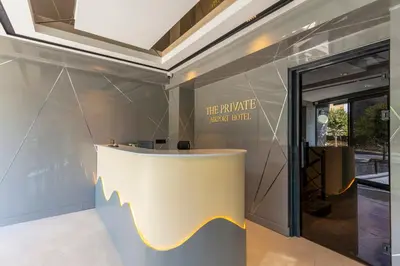 a lobby with a table and a sign that reads the private motor trial at The Private Airport Hotel in Istanbul